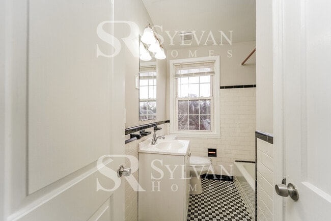 Building Photo - Welcome to this charming abode.
