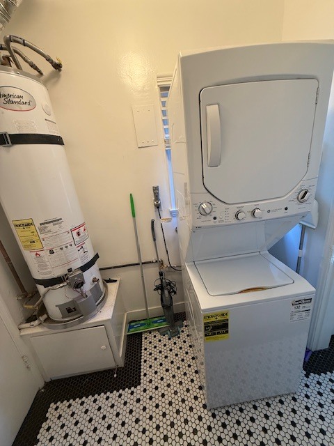 Separate laundry with washer/dryer and water heater - 4266 Troost Ave