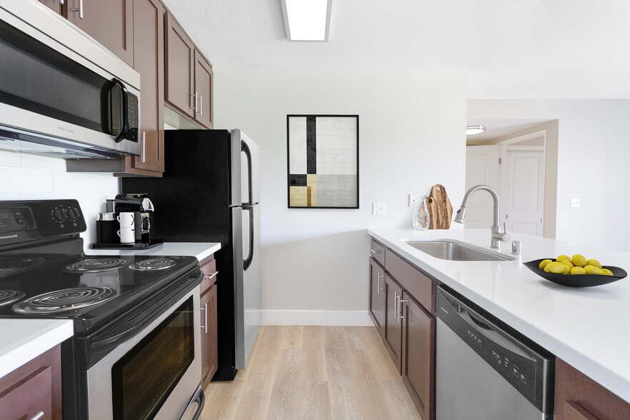 Your gourmet kitchen features brushed nickel finishes and generous storage - 15Fifty5