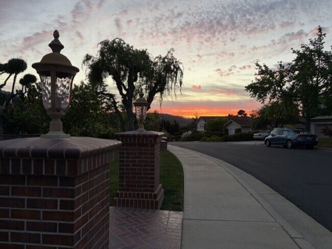 Building Photo - Remodeled 5 Bedroom Home with Heated Pool, Hillside Views, Solar, and Sunrise and Sunset Views in...