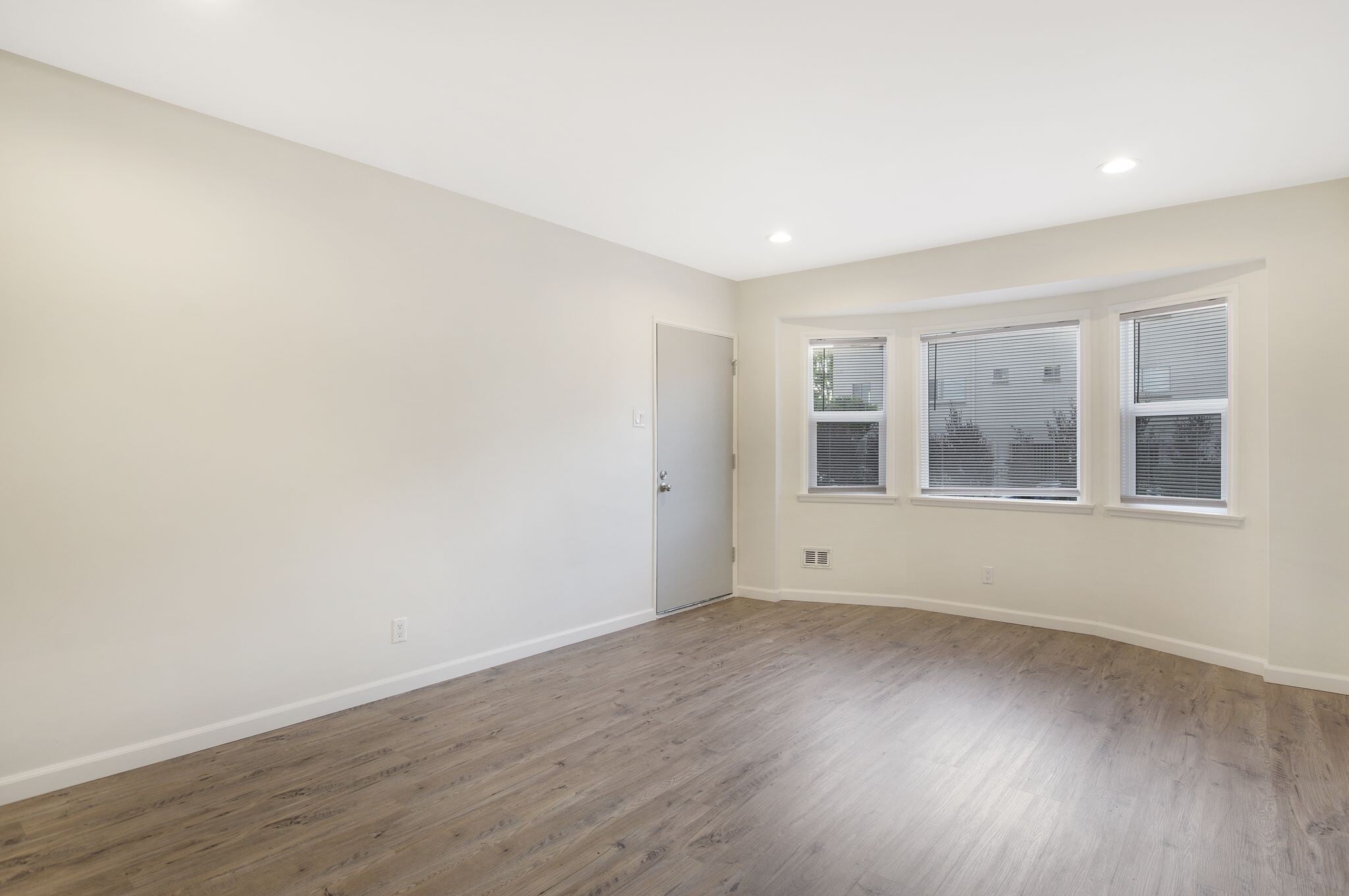 living room with double pane windows and recessed lighting - 4091 Rosecrans Ave