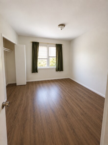 bedroom with new double pane windows - 4091 Rosecrans Ave
