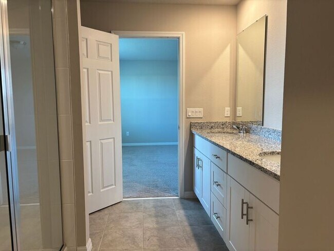 Building Photo - Like-New 4 Bedroom 3 Bath with Pond View & Two Living Spaces — Minutes to South Lake Nona
