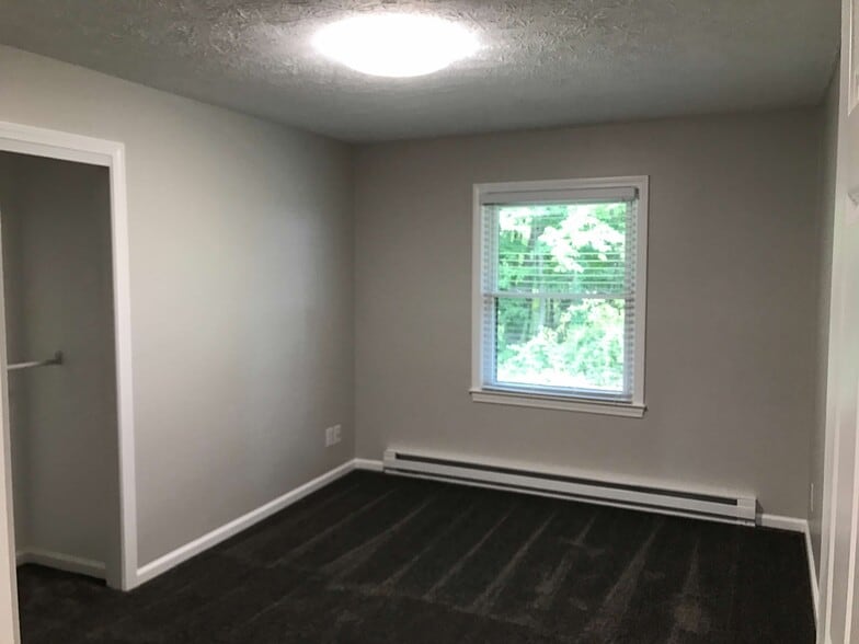 Bedroom 1. Rear. Wooded view. - 874 A Pleasant Ridge Rd