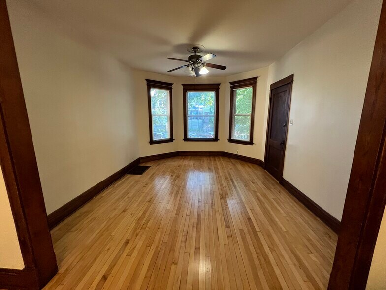 Living room with new ceiling fan - 3748 W Lyndale St