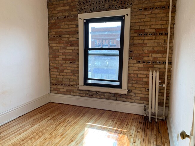Building Photo - Downtown  2 bedroom Condo across from  St. Thomas close to MCTC, UMN, MCAD . New hardwood floors