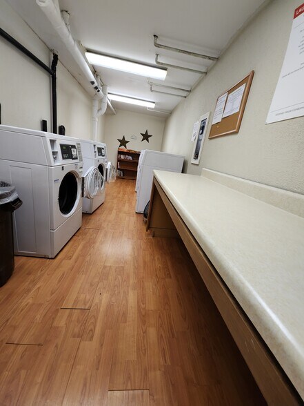 Laundry located right below the unit, new machines, area is well-kept - 24 West Rd
