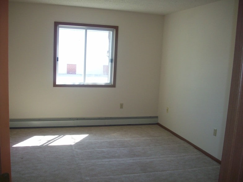 Bedroom with Walk N' Closet - Grace Manor Apartments