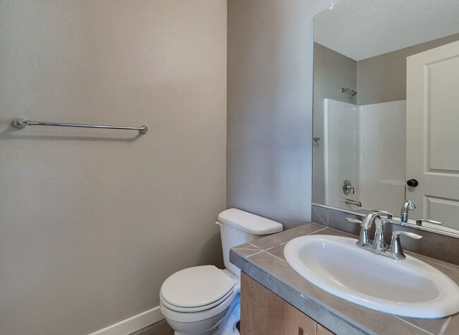 Building Photo - 2BR + 2.1BA Corner Townhome-Style Condo — Dual Primary Suites, Attached Garage & Most Utilities I...