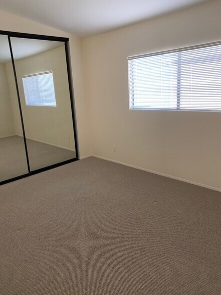 Bedroom with closet doors - 1209 Robinson Ave