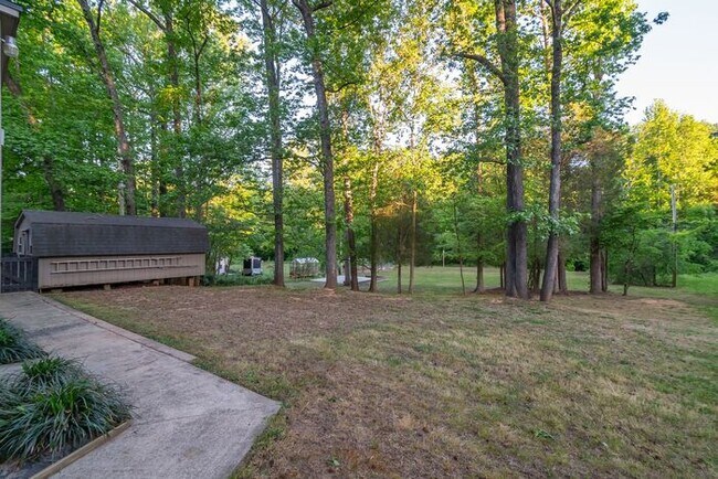 Building Photo - Spacious 4-Bedroom Mint Hill Retreat with Fireplace, 2-Car Garage & 3,600+ Sq Ft