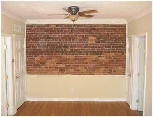 Living room exposed brick - 1504 A St NE
