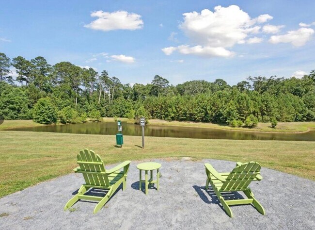 Building Photo - Townhome fresh paint and new carpet! Won't...