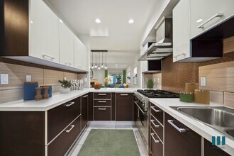 Large-Size Kitchen with Stainless-Steel Appliances and Ample Cabinet Storage - Sweetzer on Third by Wiseman