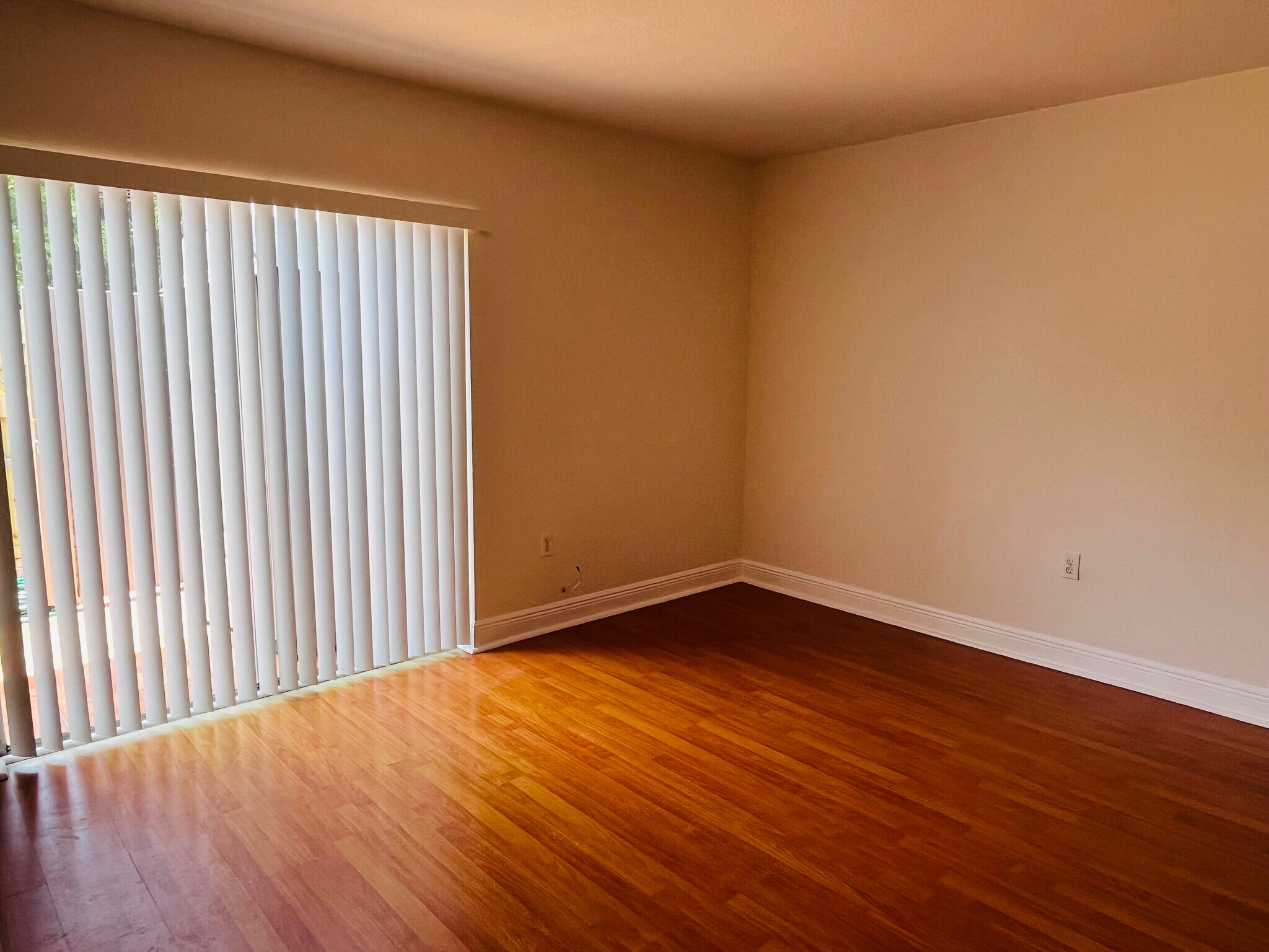 Spacious back bedroom has California closets in wood laminate floors - 8601 SW 94th St