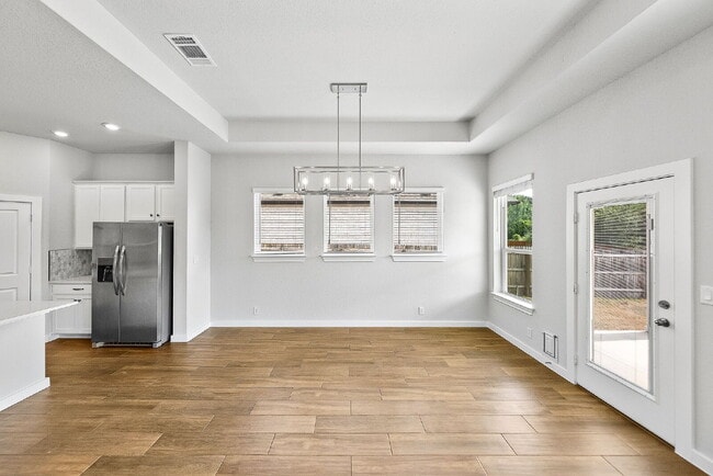 Building Photo - Greenbelt. 3 Car Garage. Built In Dog Room.