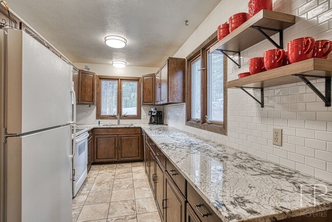 Building Photo - On the Blue River!  HUGE 4 Bedroom home, Furnished Updates throughout!  Bus route!  Spacious parking
