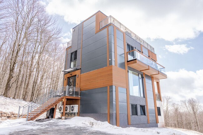 Building Photo - Modern Mountain Retreat with Rooftop Hot T...