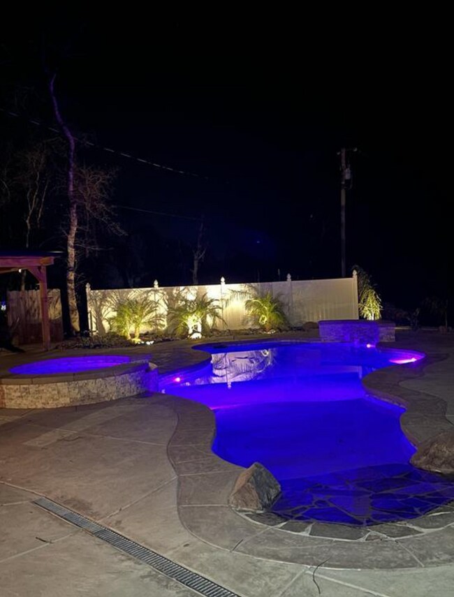 Building Photo - A Private Oasis with Unmatched Amenities 4 Bedroom 3 Bath