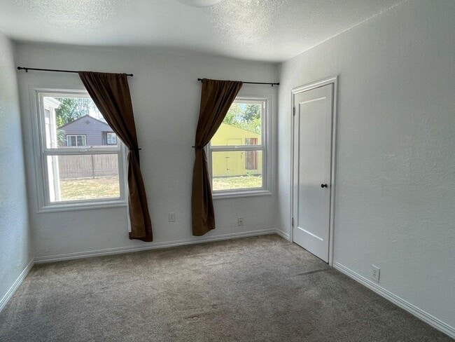Building Photo - Three Bedroom with Fenced Backyard and Shed