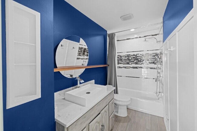 Building Photo - Completely Renovated Corner Townhome with Modern Kitchen, Designer Baths, and Private Yard