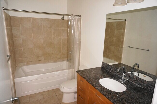 Building Photo - Large 1 Bed Loft with 20 Foot Wall of Glass City View at The VUE!