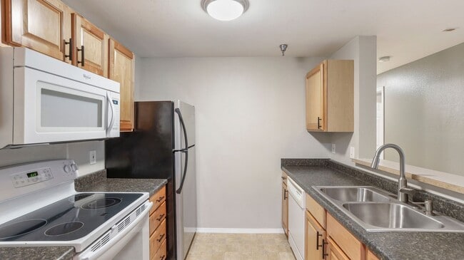 Building Photo - This ground floor corner-unit condo