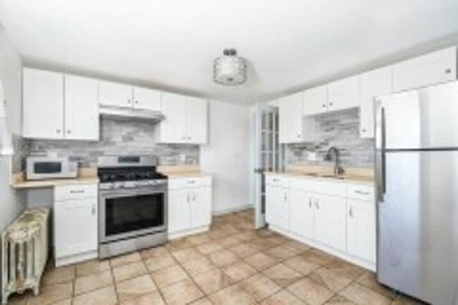 Building Photo - Renovated 4BR with In-Unit Laundry Near Moody Street