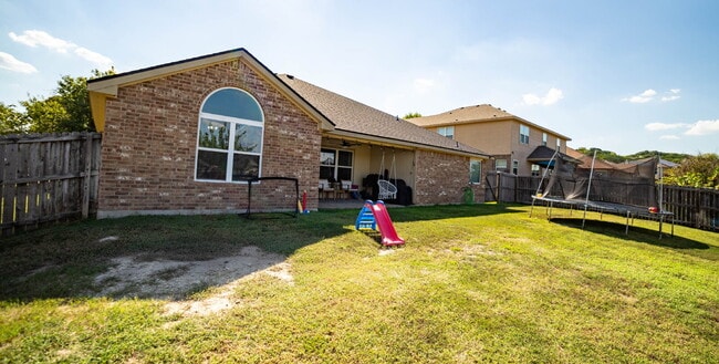 Building Photo - Beautiful 4-Bedroom Home with Spacious Bac...