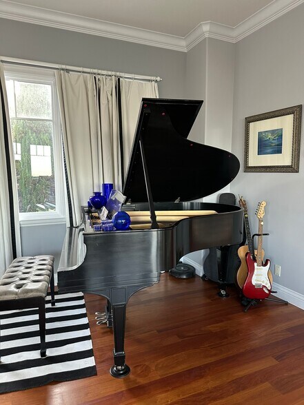 Theater/family room: Steinway grand and Yamaha electric pianos, Martin acoustic and Fender electric - 115 Inez Pl