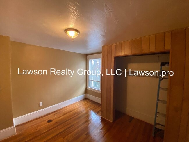 Building Photo - Updated Three Bedroom with Flat Yard