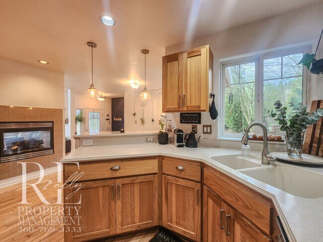 Building Photo - Light-Filled View Home with Vaulted Ceilings & Warm Wood Finishes