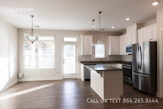 Building Photo - Like-New Townhome with a Fence & Garage!