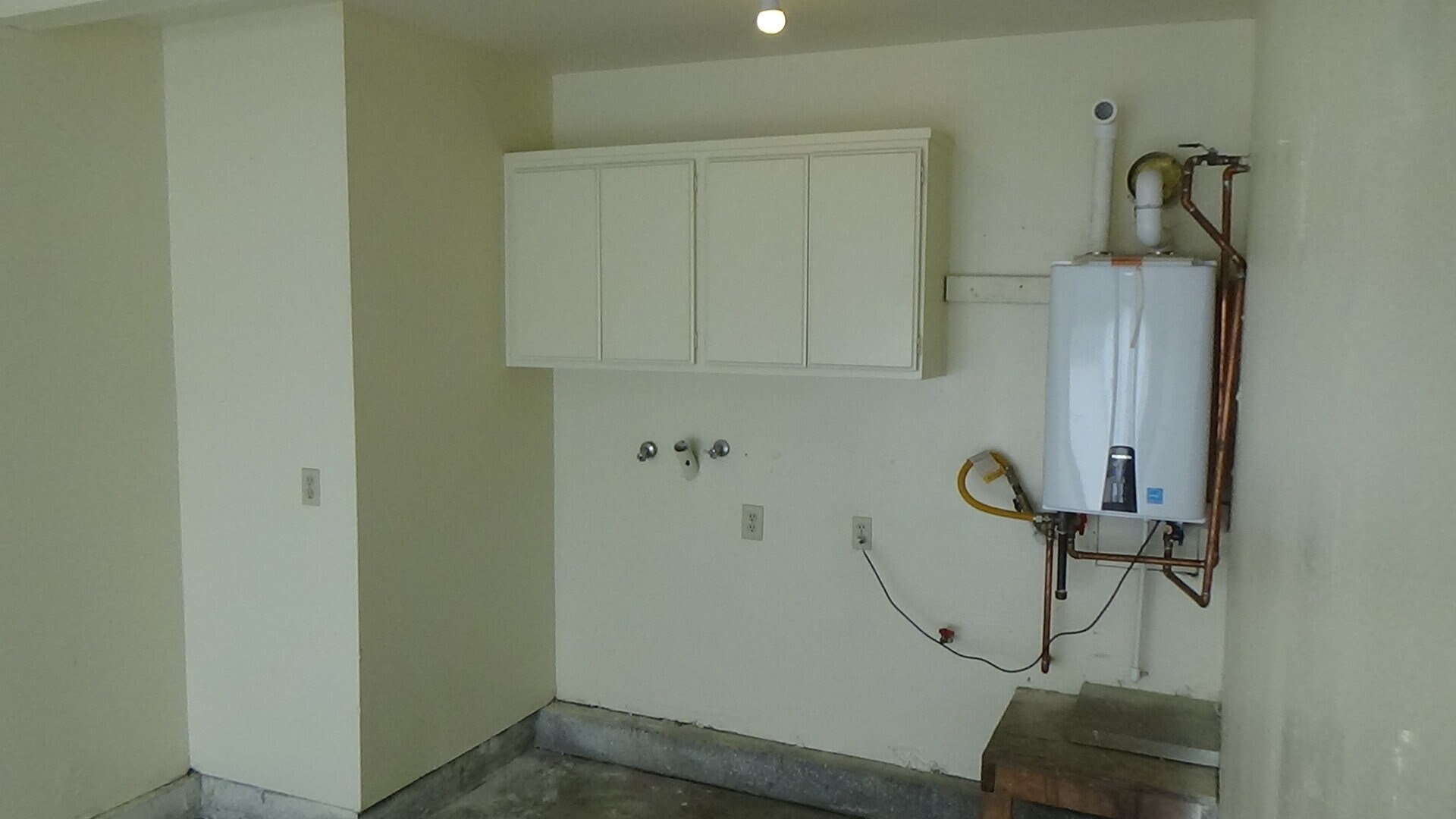 Washer & Dryer hook ups next to tankless water heater - 712 Summerwood Ln
