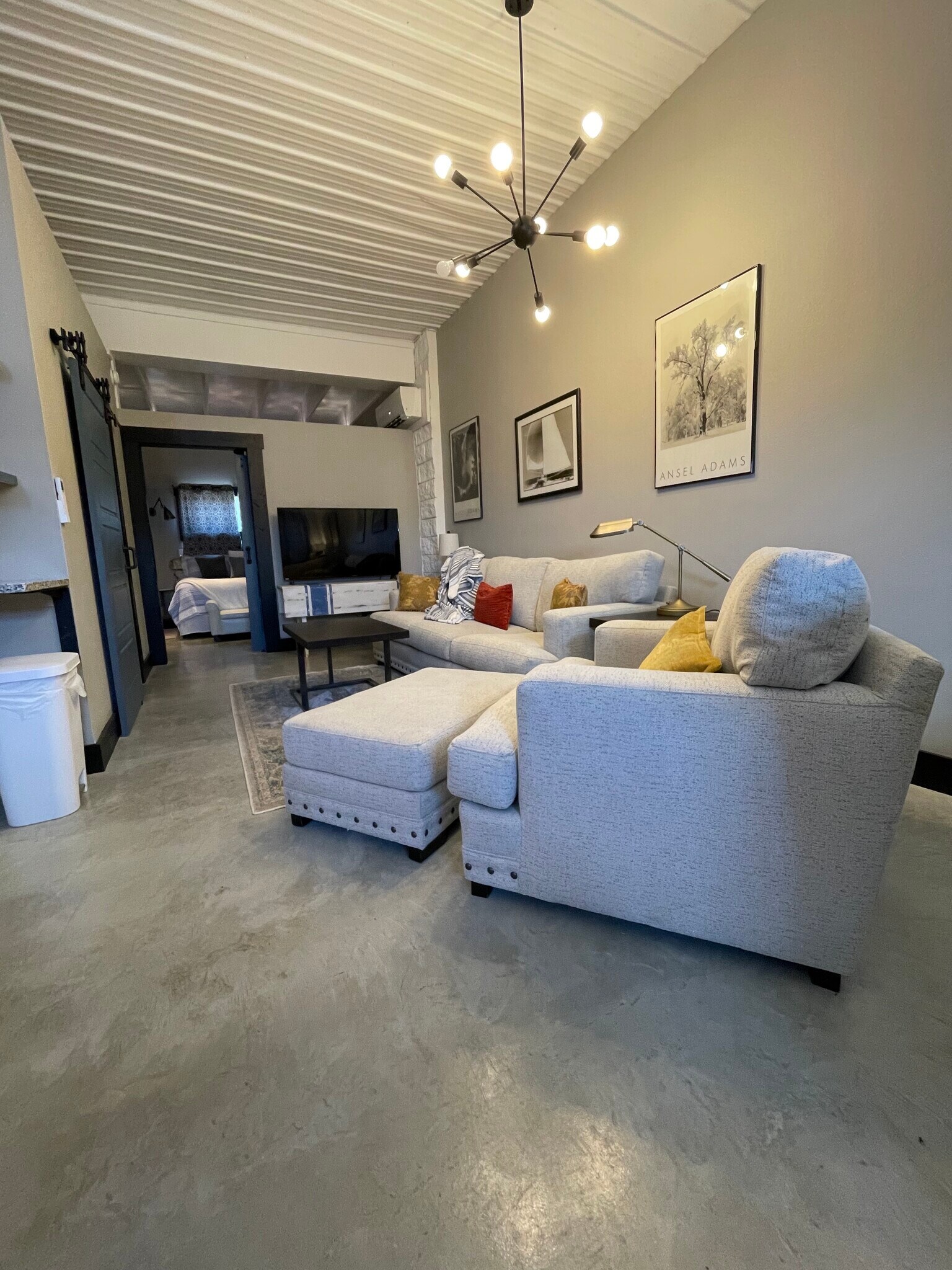 Couch, and chair-and-a half in living room, smart tv. - 475 S Hickory St