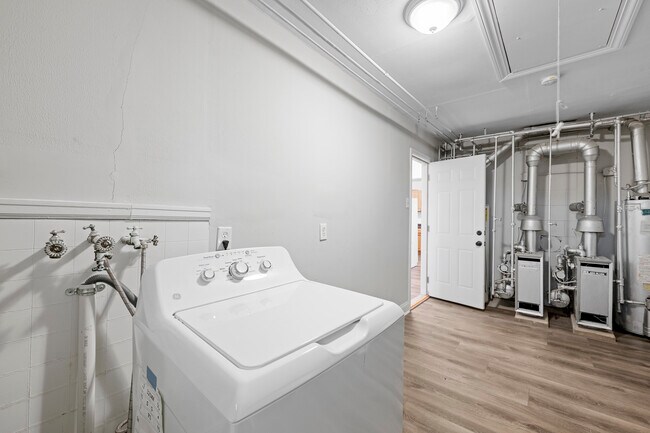 View to entry into unit. Boilers for radiant heating. - 5903 W Park Ave