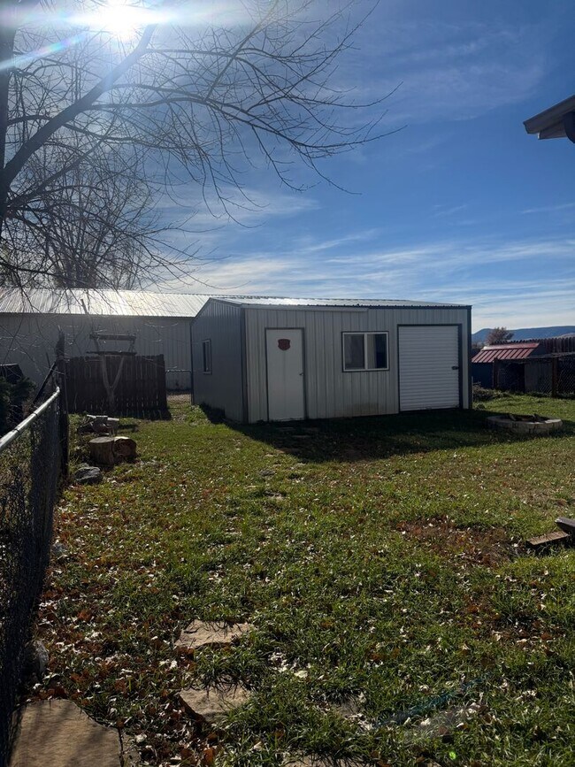 Building Photo - Spacious 3-Bedroom with Storage Shop & Off...