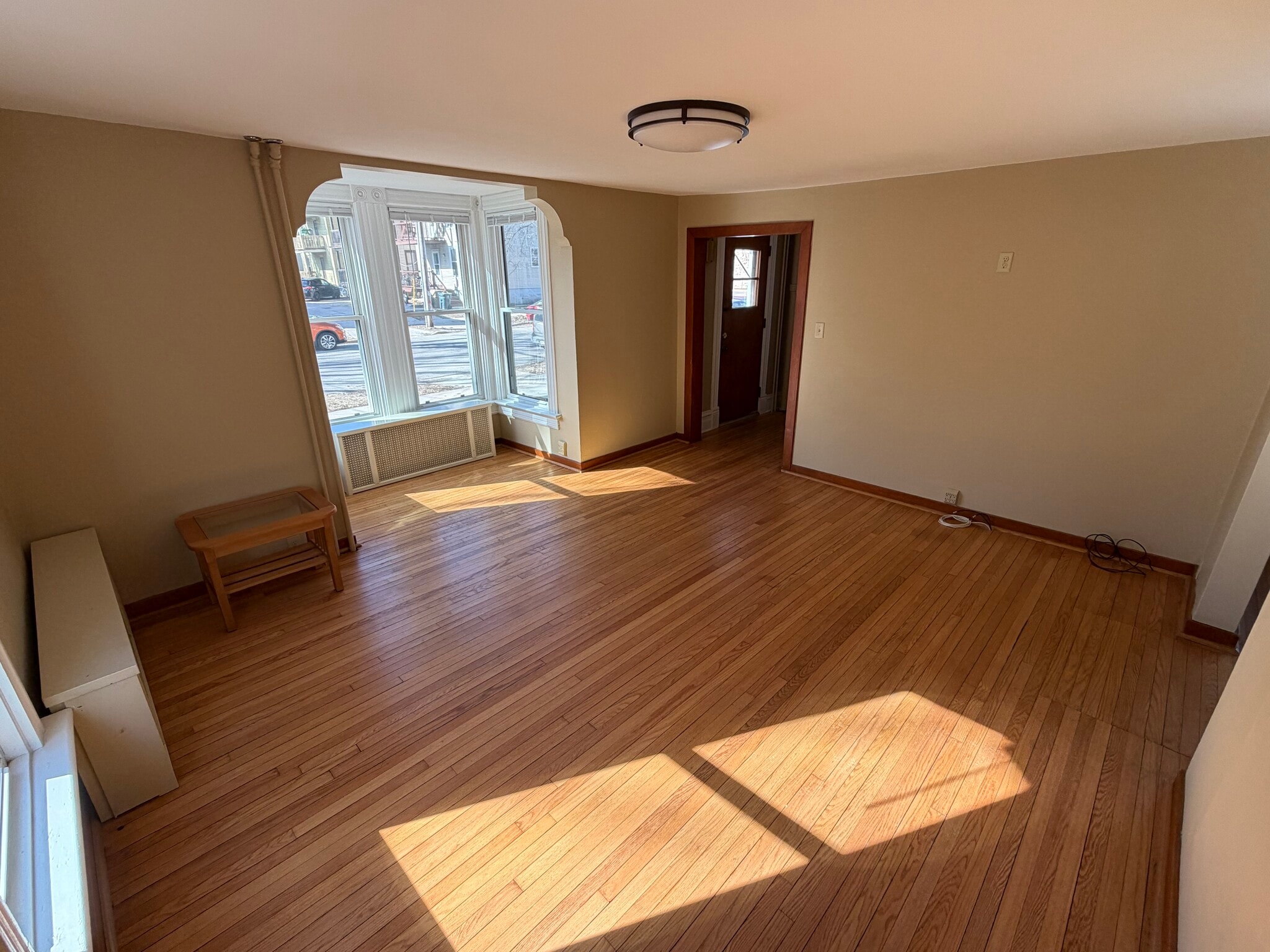 Spacious living room with natural light - 145 N Franklin St