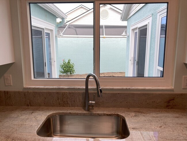 Kitchen view of backyard - 208 Mayan Ter