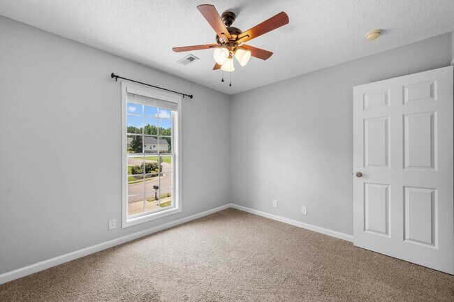 Building Photo - Stunning Stone Fireplace • Finished Basement • Fenced Yard