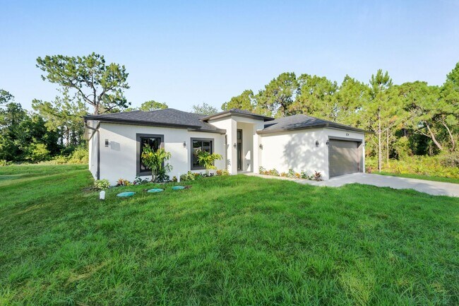 Building Photo - Brand-New Home in Lehigh Acres – Move-In Ready! FL 33974. Qualify for a deposit-free option and s...
