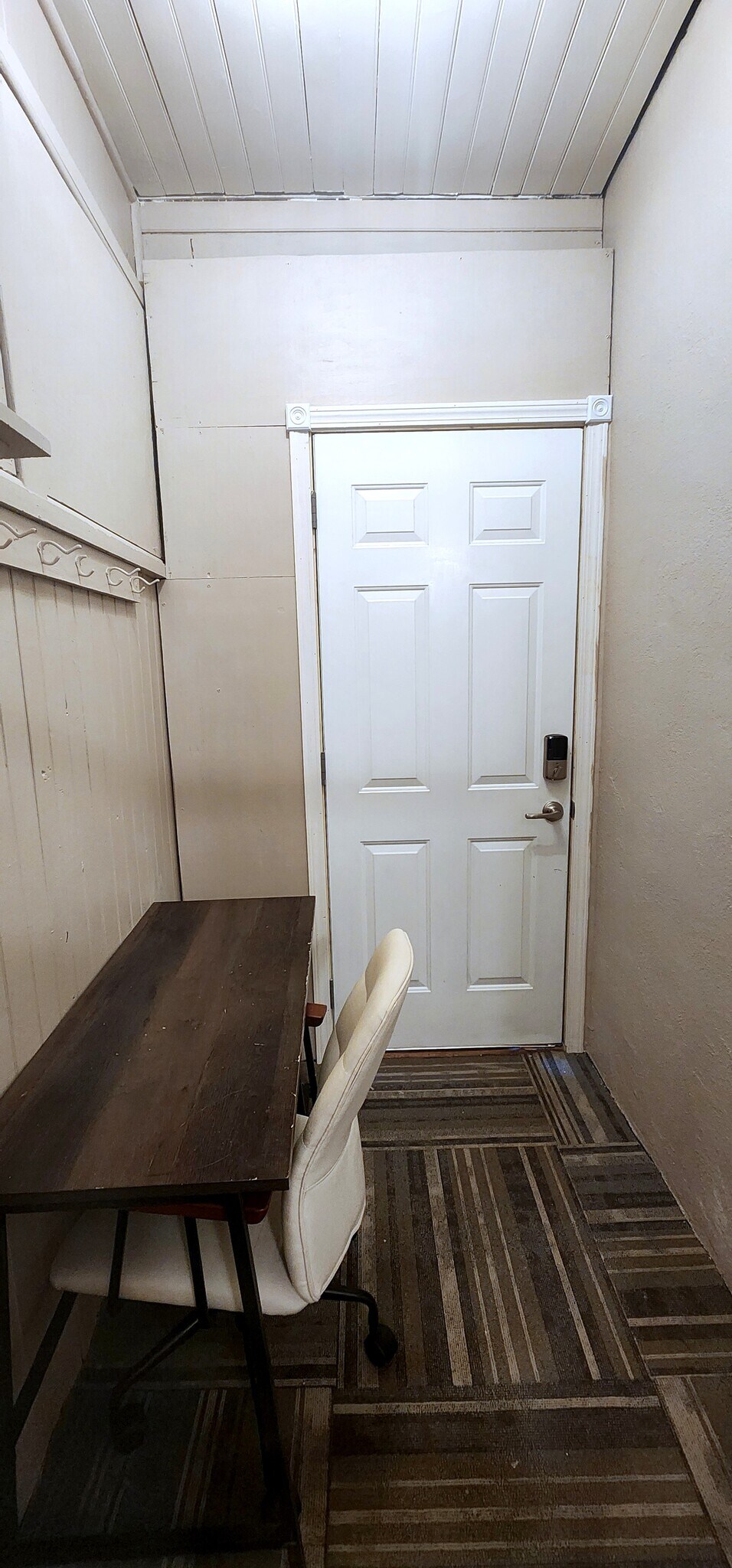 Dedicated desk and chair for remote work near the private back entrance. - 822 E 4th St