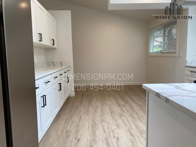 Building Photo - Stylishly Renovated Home with Private Back...