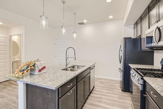 Building Photo - Beautiful 2-story modern townhome available for rent in booming Interquest & Voyager area