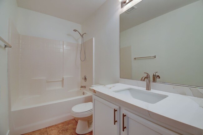 Building Photo - Great home with 4 bedrooms, 2.5 baths. New Floors Paint and Countertops.