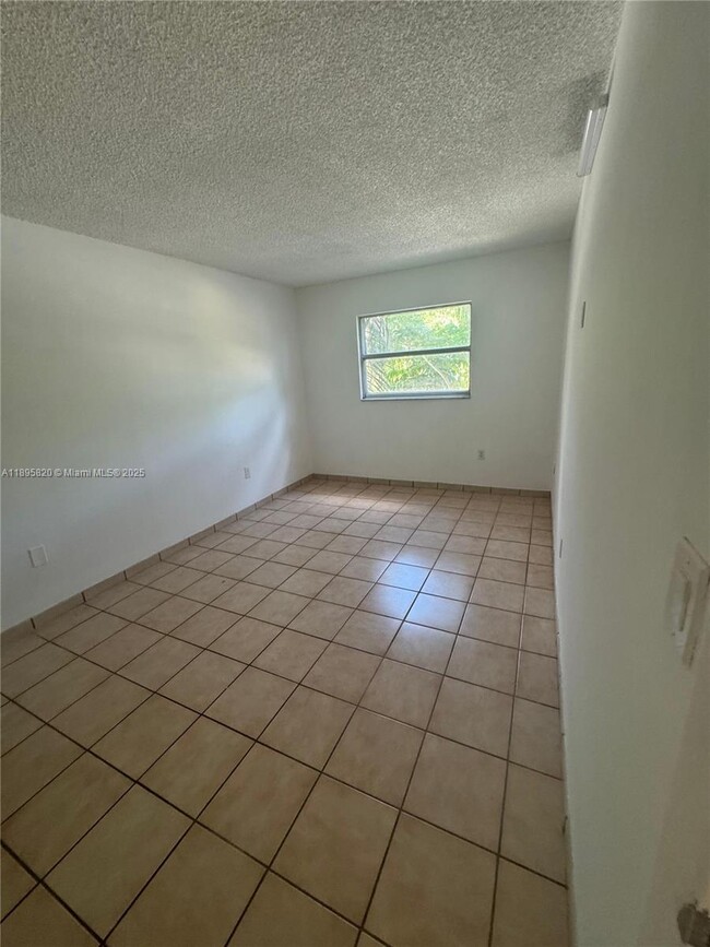 Building Photo - 4265 NW S Tamiami Canal Dr