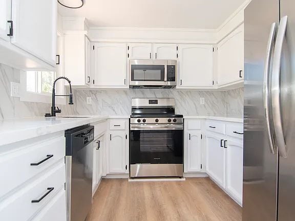 Building Photo - "Charming 5-Bed Sanctuary with Cozy Fireplace on South Rogers Street!"