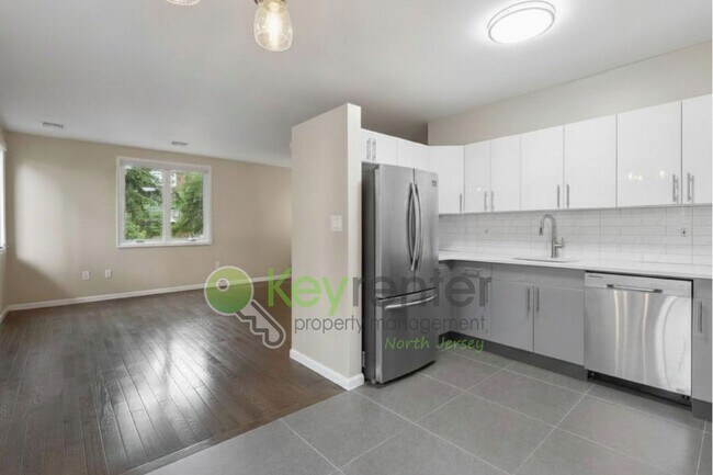 Building Photo - Spacious 2BR/2BA Duplex in Gated Community with Parking, Washer/Dryer & NYC Skyline Views
