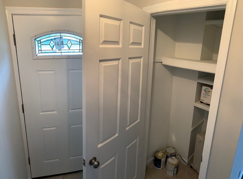 Coat closet at front door - 32 Meadow Ln