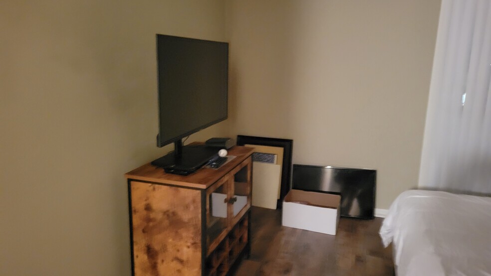 Bedroom TV and Table - 2824 S Bartell Dr